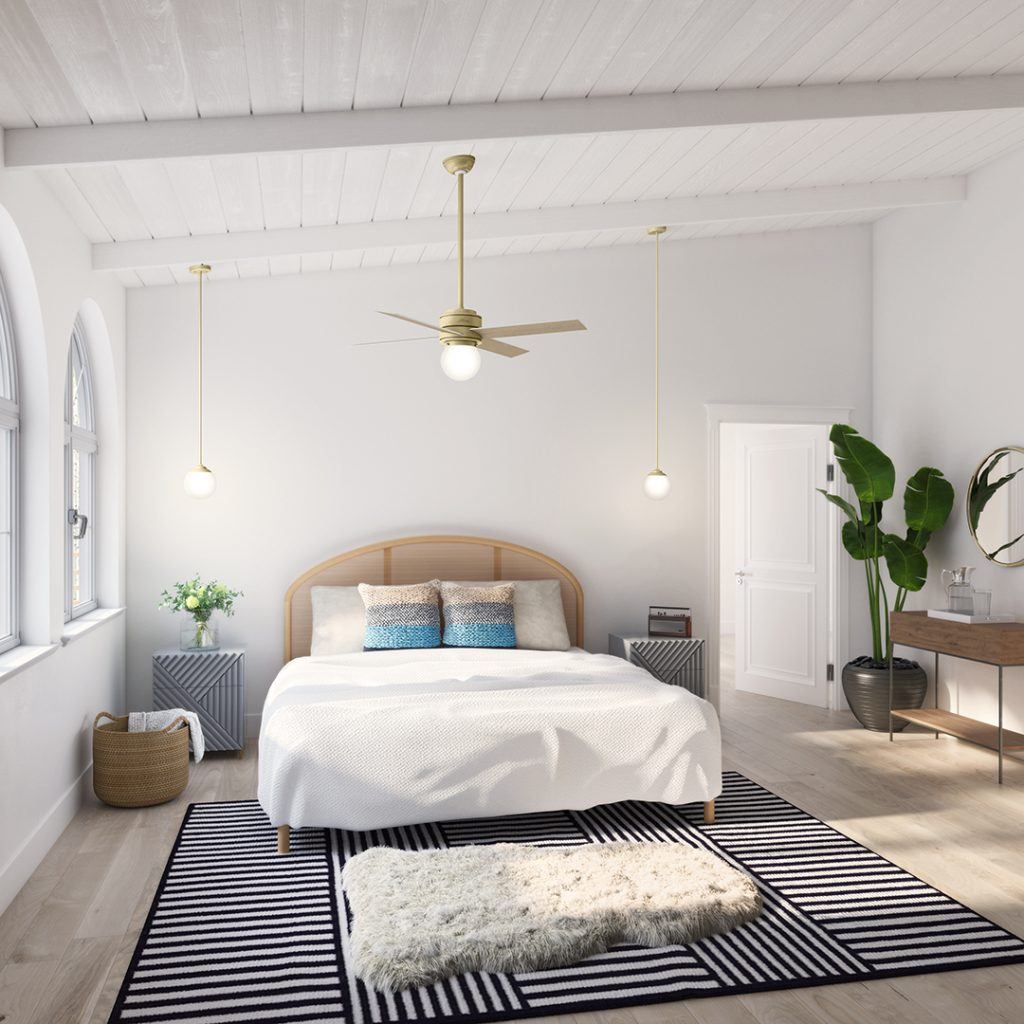 Hepburn gold ceiling fan above a bed