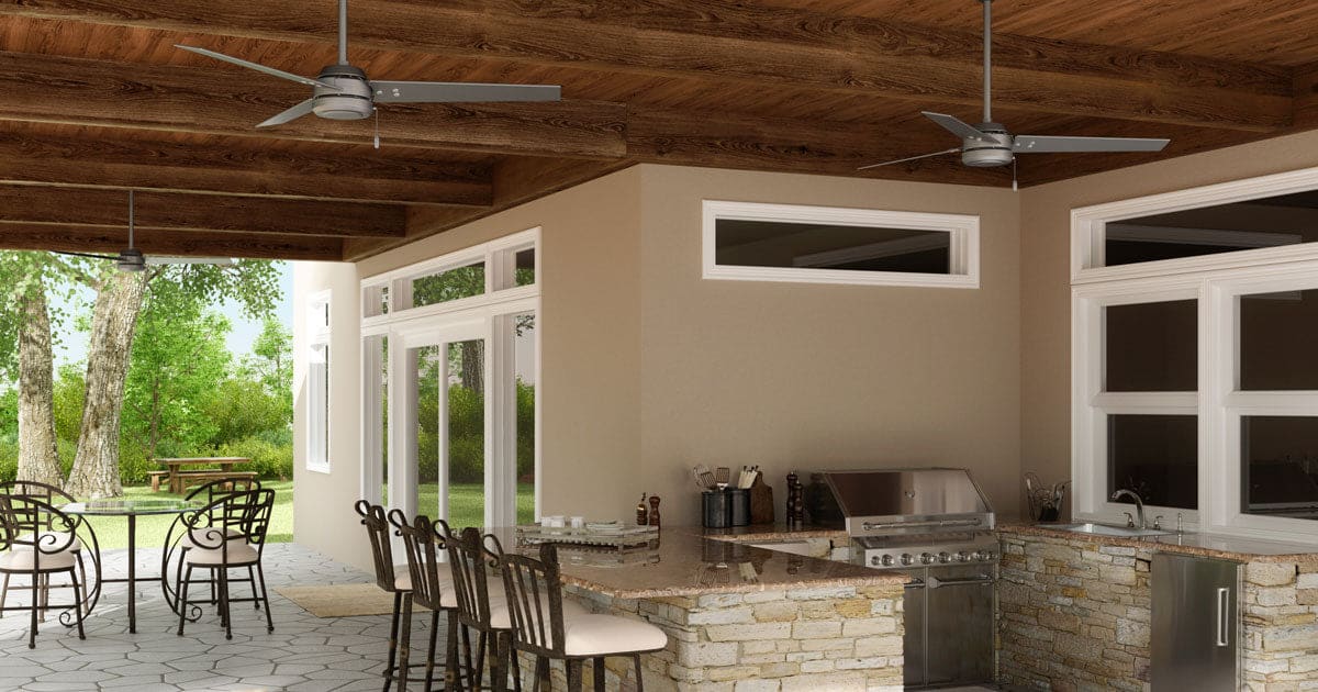 Two Matte Silver - Roasted Maple Cassius Outdoor ceiling fans over outdoor kitchen