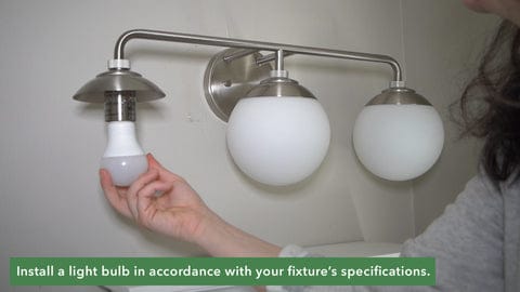 Screwing in a light bulb to specification.