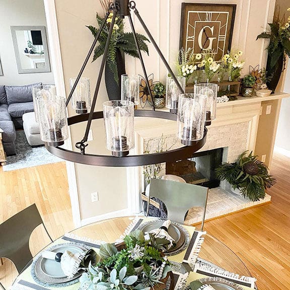 Hartland chandelier hanging above dining room table