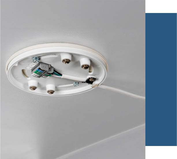 Universal mounting system mounted on white ceiling.