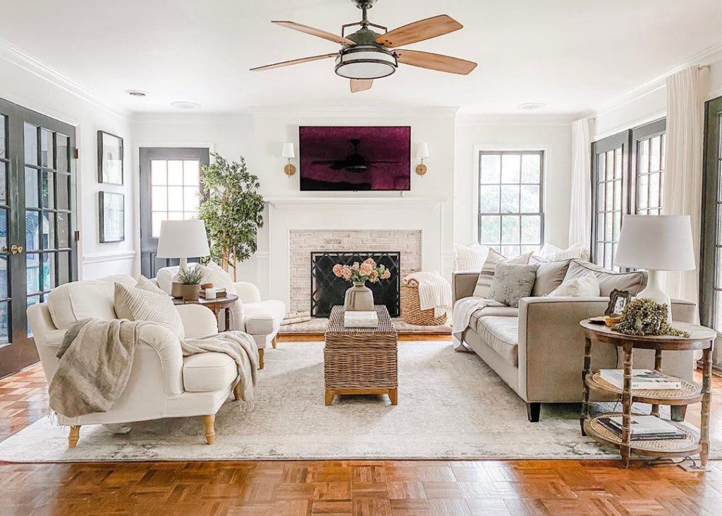 Bright living room featuring an eye catching Hunter fan