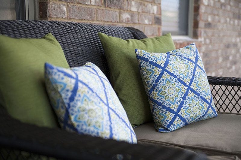 Hunter Fan Company updated patio with green and blue accent pillows