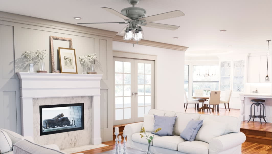 Grantham ceiling fan with 4 led lights in matte silver finish hanging in an open living space.