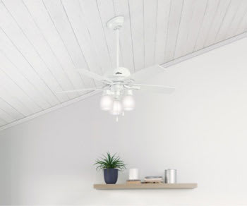Ceiling fan on vaulted ceiling with angled mount and downrod