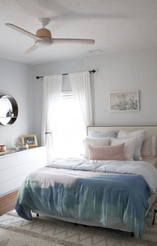 Huntervention Palm Springs AirBnB modern guest bedroom with blue and blush pink bedspread