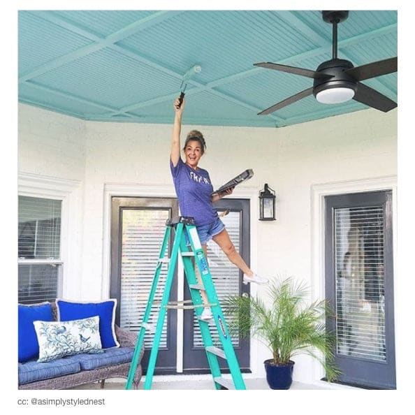 affiliate on a ladder painting a ceiling