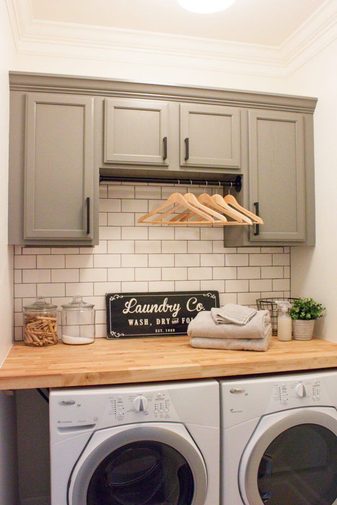 farmhouse laundry room with grey cabinets