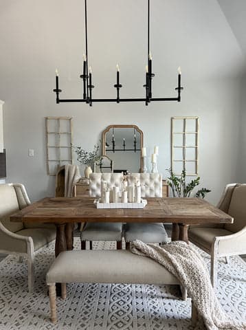 Briargrove Linear chandelier hanging above a dining room table