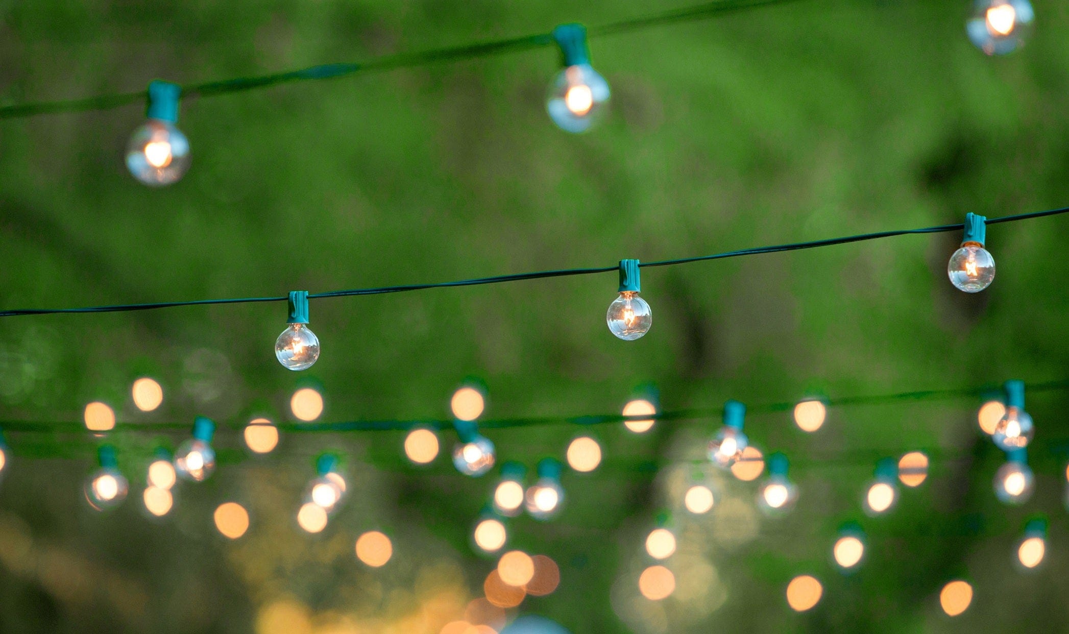string of lights decorating an outdoor patio