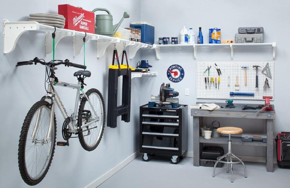 Garage with workbench, tools, and bicyle