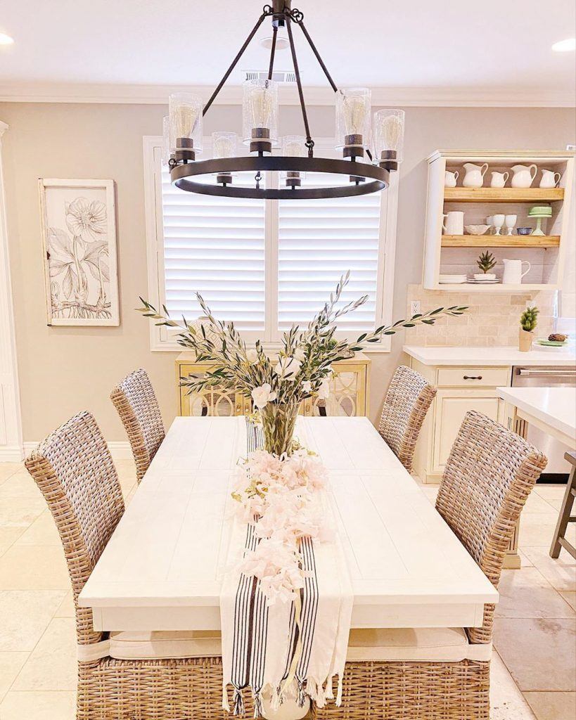 Hartland from Hunter lighting hanging above a dining room table to create a stunning farmhouse look